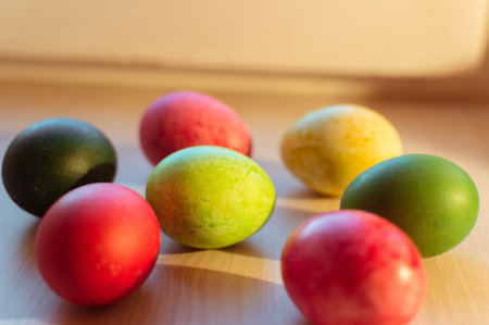 Bright colorful Easter eggs and their shadows on the table, spring holidayの写真素材