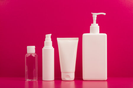 Set of cosmetic products for skin care on bright pink backgroundの写真素材