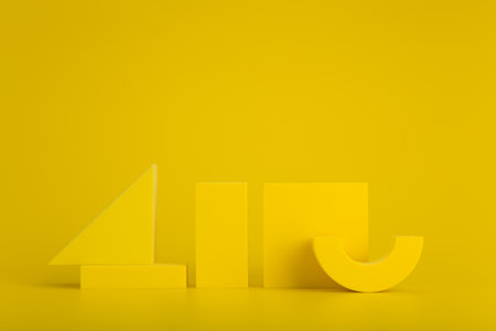 Abstract yellow background with yellow geometric figures against yellow background with copy spaceの写真素材