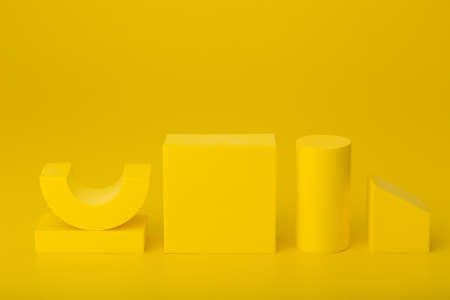 Yellow geometric background with copy space. Abstract monochromatic composition.の写真素材