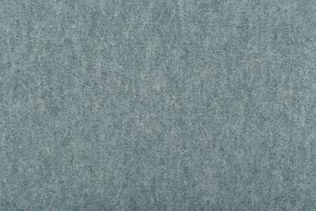 Blue fluffy material close up. Knitted texture background