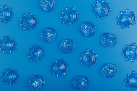 Creative flat lay with sea shells on blue background. Summer compositionの写真素材