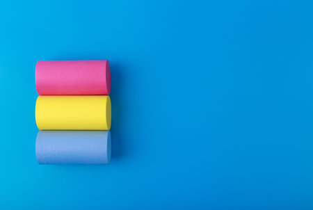 Pansexual flag on blue background with copy space Symbol of pansexual community