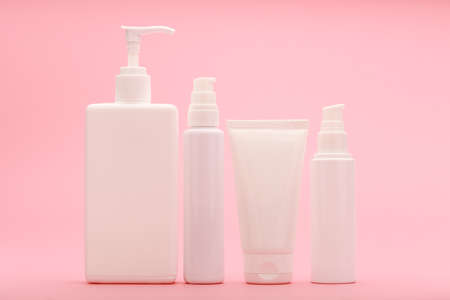 Set of beauty products for daily anti acne skin treatment against light pink backgroundの写真素材
