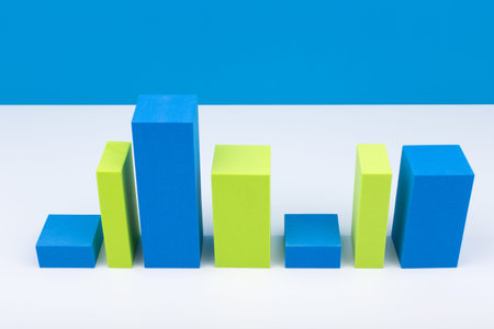 Creative business concept. High angle view of green and blue graph diagram with rise and fall...