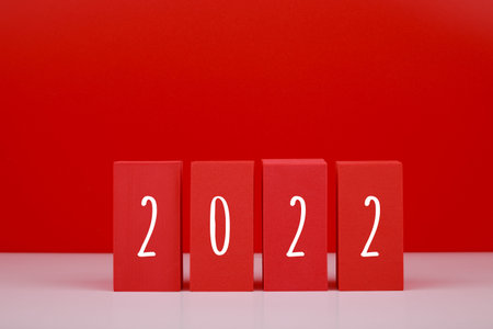 2022 Happy New Year red minimal trendy concept. Modern composition with red blocks with written 2022...
