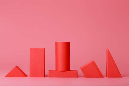 Abstract trendy futuristic background in pink and red colors with copy space. Monochromatic artsy background with different geometric figures in a rowの写真素材