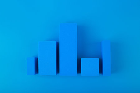 Business graph diagram or performance chart with blue bars with rise and fall dynamic against blue...