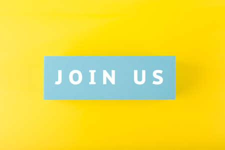 Trendy minimal job opening or headhunting concept. Join us written on blue rectangle against yellow backgroundの写真素材