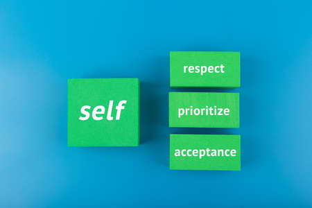 Self respect, acceptance, respect and prioritize concept in blue colors. Mental health, self love and wellness conceptの写真素材