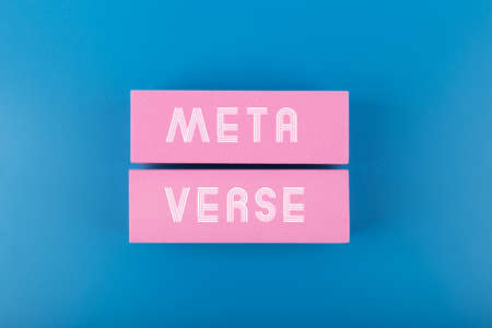 Metaverse modern minimal concept with written text meta verse on pink rectangles against dark blue backgroundの写真素材