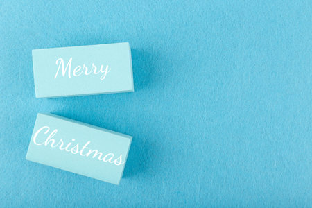 Merry Christmas minimal concept in light blue colors with copy space