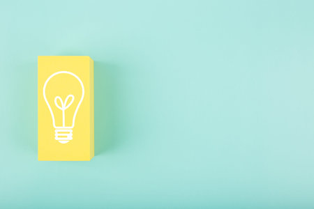 Concept of idea, creativity, start up or brainstorming. White light bulb drawn on yellow rectangle...