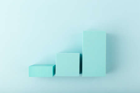 Business performance chart with rise dynamic against blue background with copy spaceの写真素材