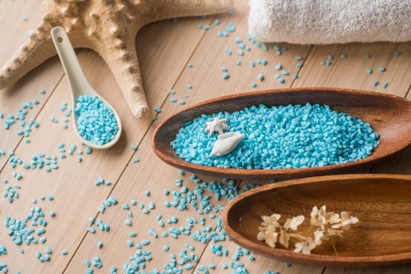 Spa setting with flower and towel on wooden background.の写真素材