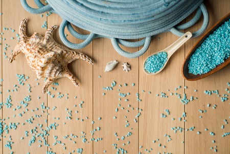 Spa setting with flower and towel on wooden background.の写真素材