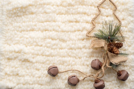 Christmas composition. Christmas tree, knitted white scarf. Place for inscriptionの写真素材