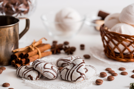 Black tea with cookies and cinnamon on a white wooden white backgroundの写真素材
