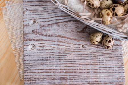 Textured spring background with small quail eggs. Eco products. Horizontal formatの写真素材