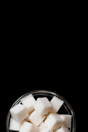 Sugar refined in a glass plate. Place for your inscription, Copy space, top viewの写真素材