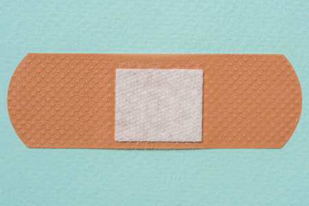 medical plaster on a blue background, Copy space, top view