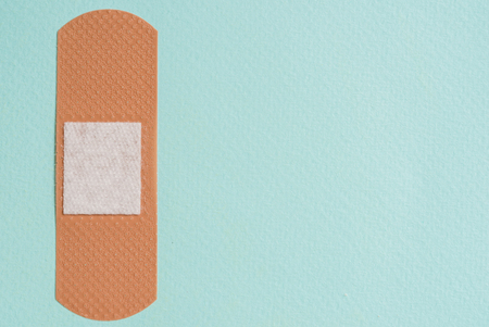 medical plaster on a blue background, Copy space, top viewの写真素材