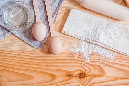 Basic ingredients for baking, egg and flour on table. Top view. Copy space.の写真素材
