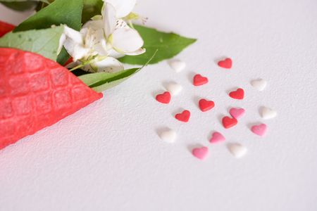 Waffle ice cream cones with white peony flowers on red pink background. Summer concept. Copy space, top view. Minimalismの写真素材