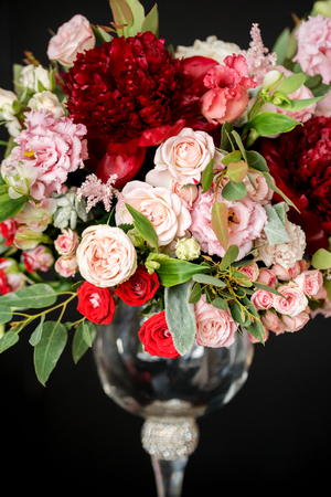 wedding flowers, floristic in glass vases, black background, red and purple roses, wine flowers, Luxurious bridal bouquet, design solutionの写真素材