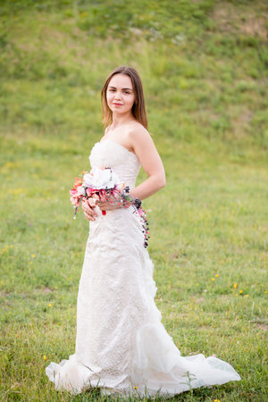 School of Floristry Stas Zubov in Minsk, Republic of Belarus. July 2018. Avant-garde wedding bouquets and arches for exit registration. Graduates of school in wedding dresses. floral art art. Edited.のeditorial素材