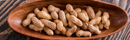 Snacks - mix of energy bars with peanut, sesame and sunflower seeds on a wooden background. Nuts in...