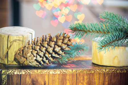 Christmas lights bokeh, hearts. Spruce of New Year's spruce and cones.の写真素材