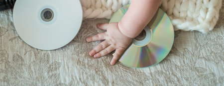 Long banner. Little DJ. Little Baby, CD drive, takes a hand on the bed