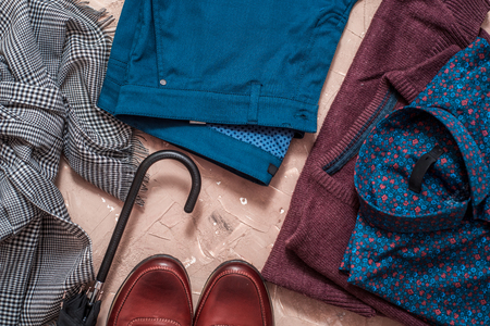 Set of men's clothing and accessories on blue wooden table. concept of businessman, classic fashionの写真素材