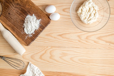 Ingredients for making pancakes - egg, butter, milk, for pancakes on wooden background. Top view with free text spaceの写真素材