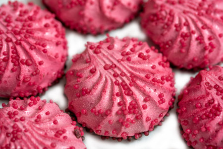 Homemade pink zephyr or marshmallow in pink plate on white background with copy space. Raspberry...