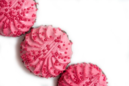 Homemade pink zephyr or marshmallow in pink plate on white background with copy space. Raspberry berry round marshmallow in chocolate. Valentine's or Mothers Day conceptの写真素材