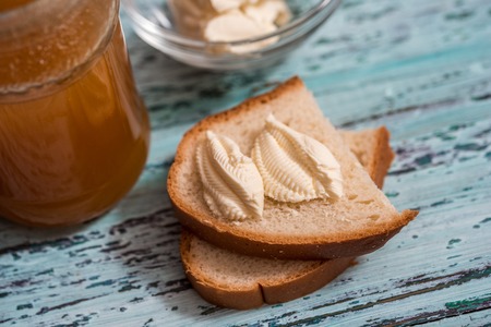 Top view of breakfast set with dry toast bread, butter and honey.の写真素材