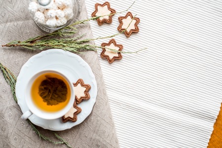 Cinnamon stars and cinnamon sticks on a festiveの写真素材