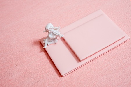 Open notebook and red hearts on pinkの写真素材