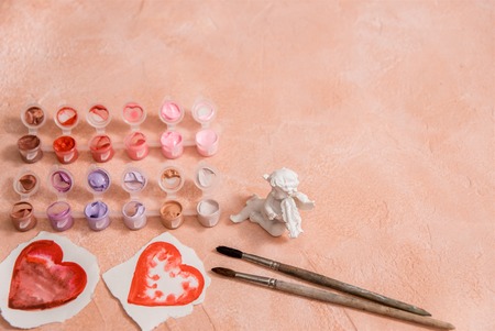 Colored paints and brushes, valentine day, heart drawing with watercolorの写真素材