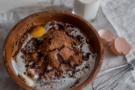 Ingredients for making cake chocolate. Chocolate muffins, knead dough.の写真素材