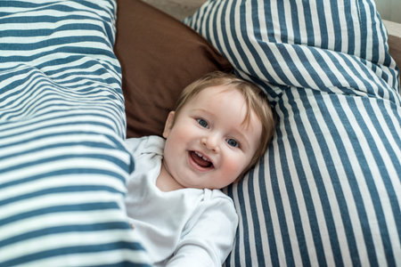 Close up face of Kid yawning and holding teddy bear, Sleepy child yawning and looking at cameta,...