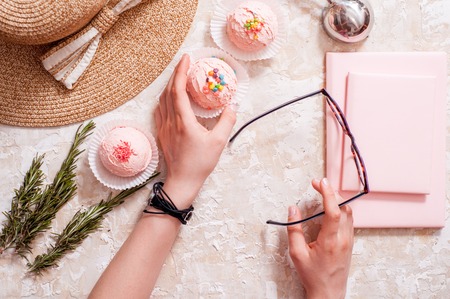 Summer Girl Accessories Fashion Design. Trendy Cap and Ice Cream. Creative Bright. Flat lay. Minimal, Art summertime concept. Mobile phone and pink notepad, Business woman's, glassesの写真素材