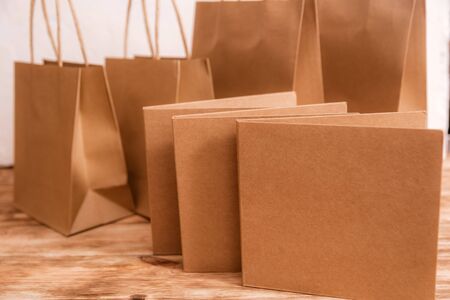 Two stack of blank craft business cards on wooden background Verticalの写真素材