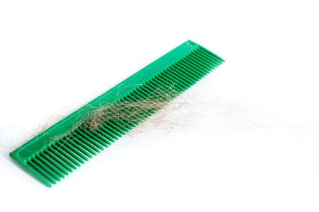 Avitaminosis in women. Hair loss. comb with loose hair. Scalp treatment. Hair care concept. copy spaceの写真素材