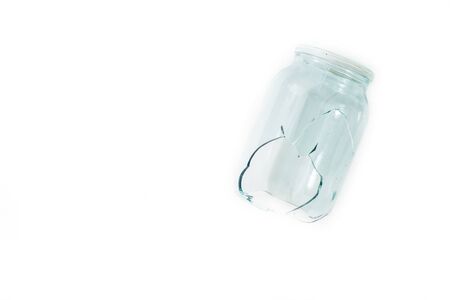 Broken glass jar, broken glass on white background, concept of danger. copy spaceの写真素材