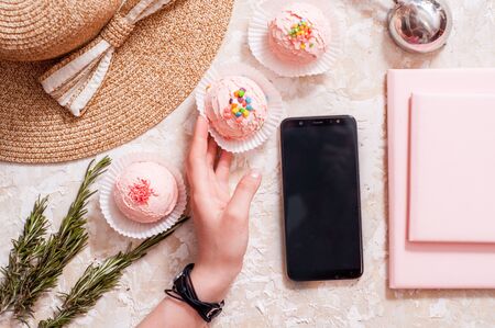 Summer Girl Accessories Set. Fashion Design. Trendy Cap and Ice Cream. Creative Bright. Flat lay. Vanilla Pink Color. Minimal, Art summertime fashionable concept. Mobile phone and pink notepadの写真素材