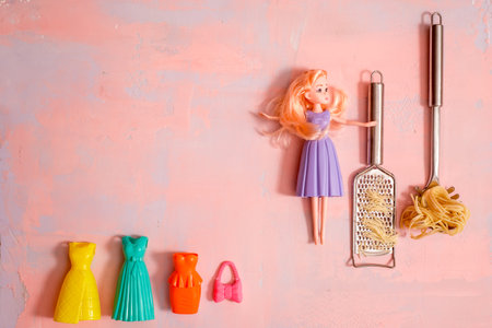 housewife cleaner. lady housewife, fashionable dress, doll fashion. The girl is cooking pasta. Copy...