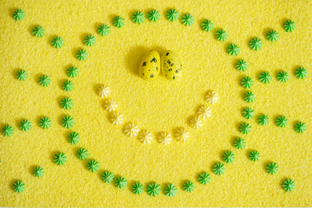 Top view Smile.Easter colored eggs in circle on yellow background. Bright postcard.eggs Easter Frame...